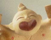 陶器の縁起物人形「ビック笑顔」